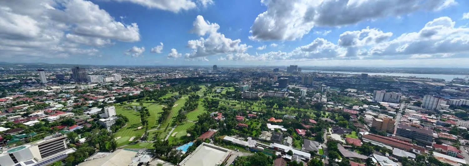 View from Bauhinia Drive toward the northeast, overlooking Cebu Country Club — actual photo, developer materials